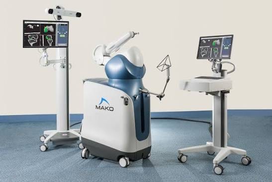 The Stryker Mako robotic-arm assisted surgery system with its camera stand and guidance monitors.
