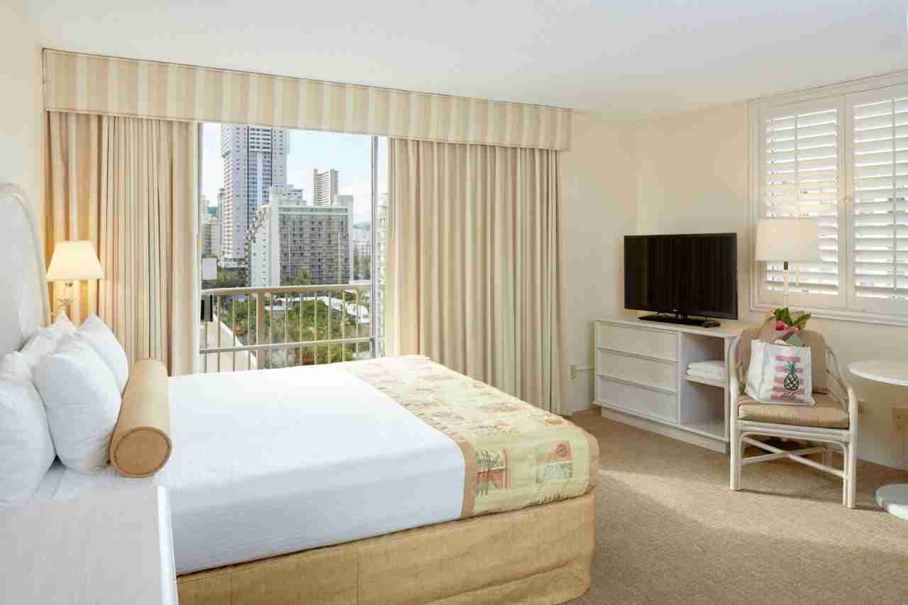 Guest room with city view at the Ohana Waikiki East by Outrigger hotel in Honolulu.