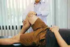 Physical therapists are using the handle to the patient knee to check for pain. 2 Hip and Knee 3