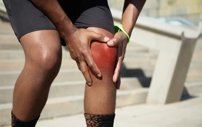 closeup young man with knee injury 1