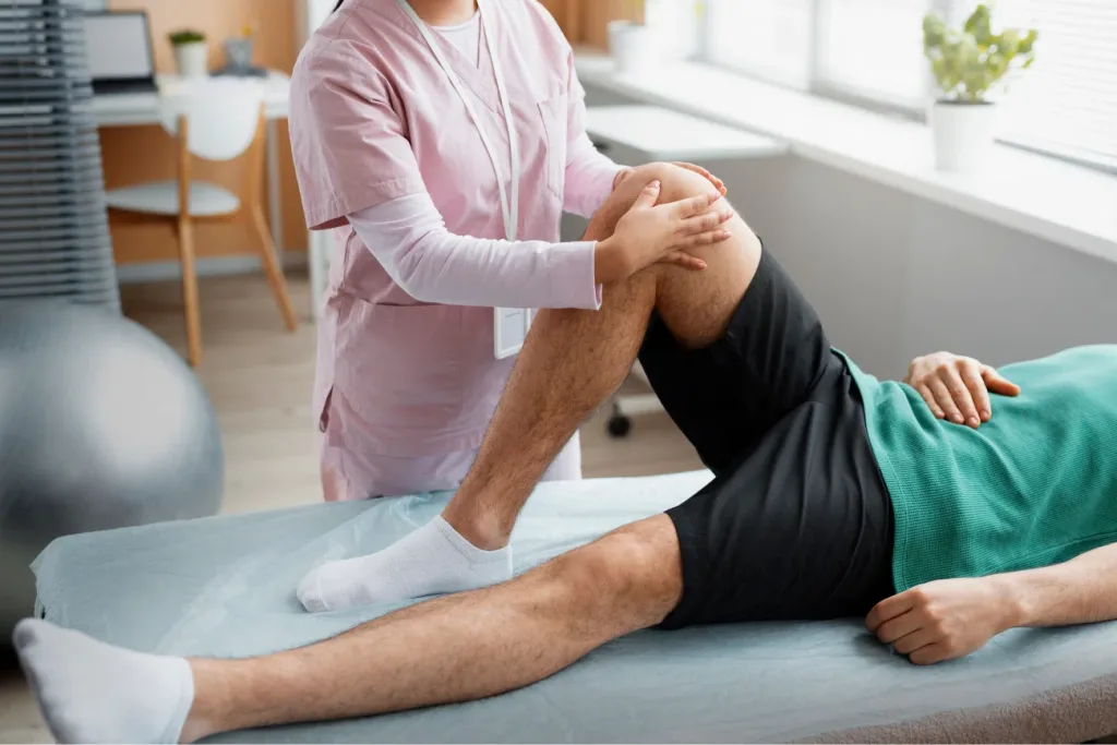 doctor helping patient during rehabilitation 1